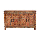 A rustic distressed wood sideboard cabinet with four doors, three drawers, and carved decorative details, shown against a plain white background.