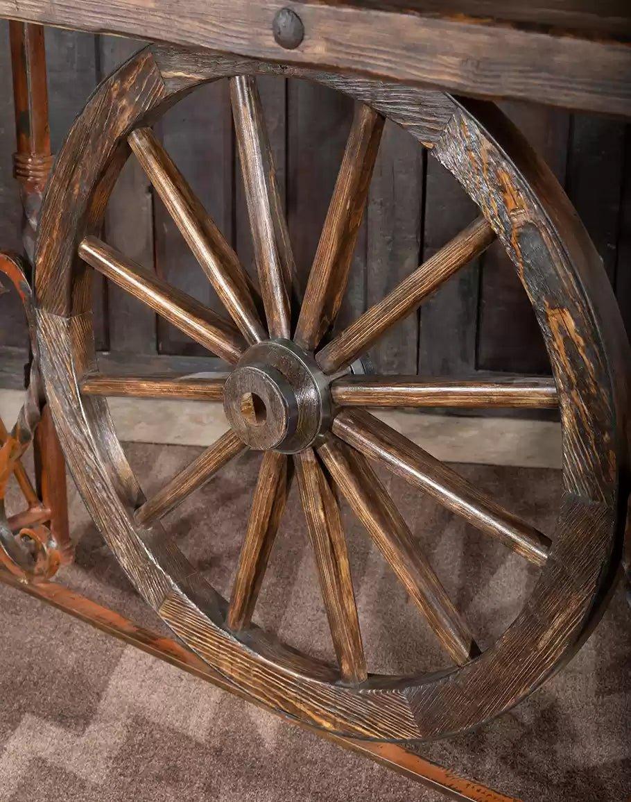 Center wagon wheel on hand-forged iron western pub table - Your Western Decor