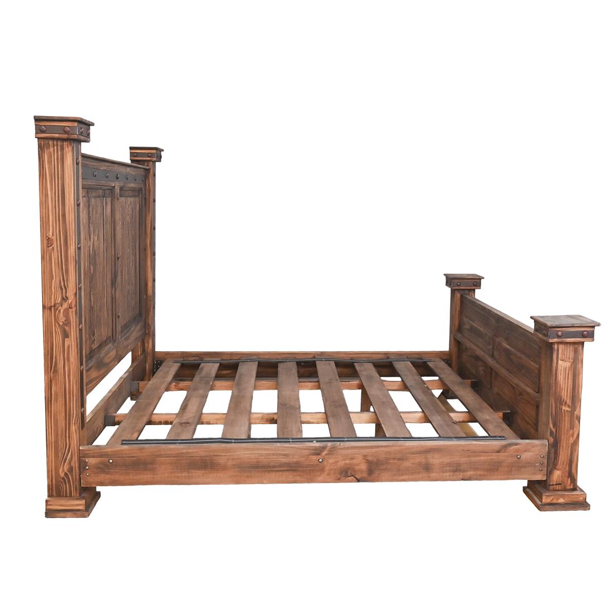 A rustic wooden bed frame with a slatted base, featuring a tall paneled headboard and matching footboard with turned posts, shown against a plain white background.