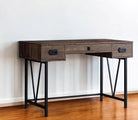 Wooden desk with black metal legs and wood top with 3 drawers against a white wall on a hardwood floor - Your Western Decor