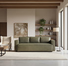 Modern living room with a green sofa, wooden shelves, and abstract art.