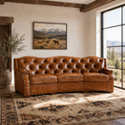 Santa Fe curved and tufted leather sofa with 3 seat cushions in ranch style bright room - American made