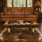 Hand burnished sauvage bark button back leather sofa with longhorn and cowhide coffee table and steer horn lamp with rawhide lamp shade