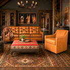sauvage button back hand-burnished leather sofa with palomino boot stitch leather swivel chair and Trio of Horses art 
