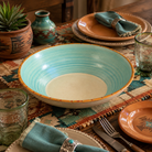 turquoise and off white handmade Southwestern serving bowl with hand-painted rim in orange with red and green painted dots, made in the USA