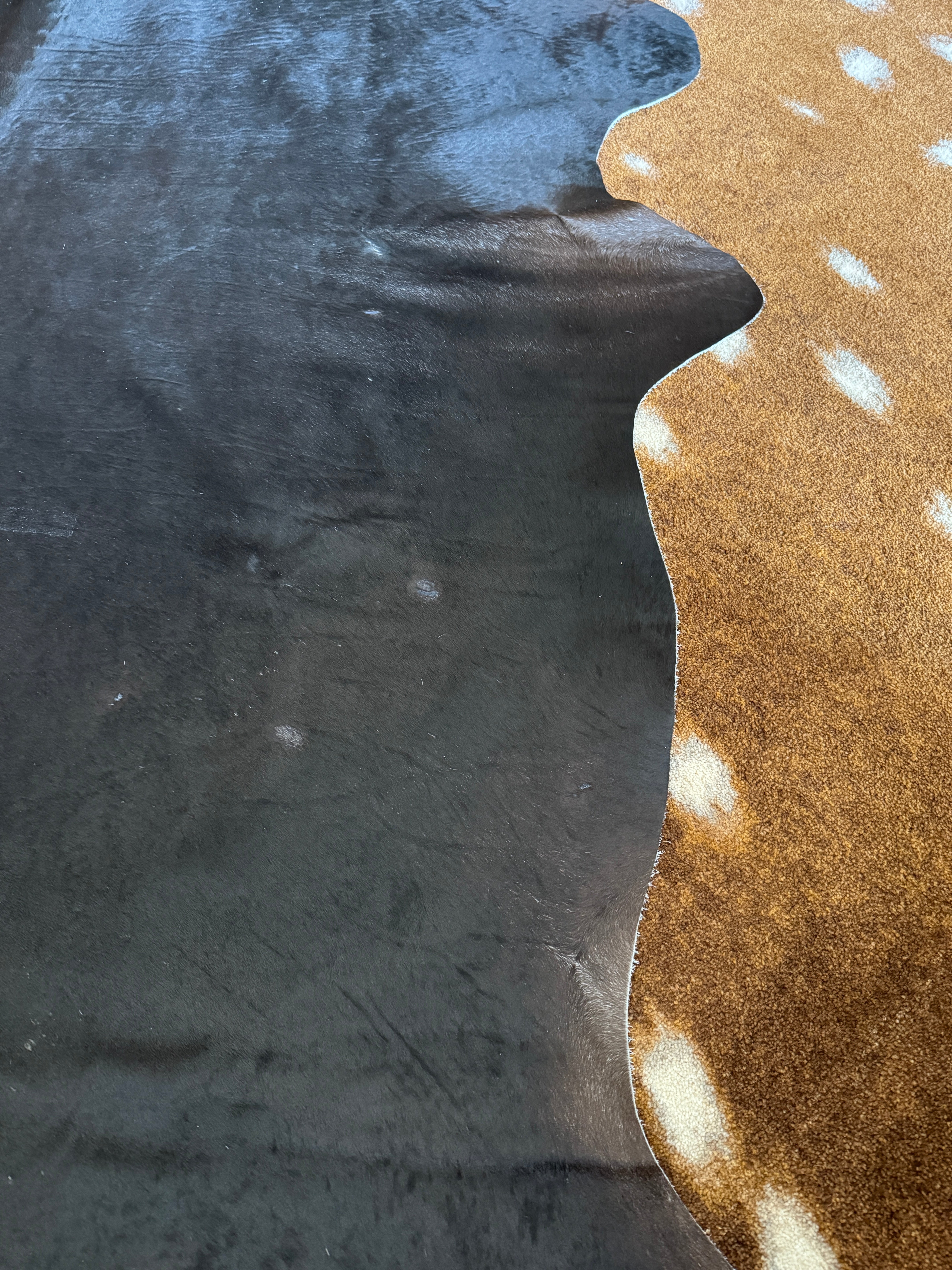 dark cowhide rug with brown undertones luxury western home styling