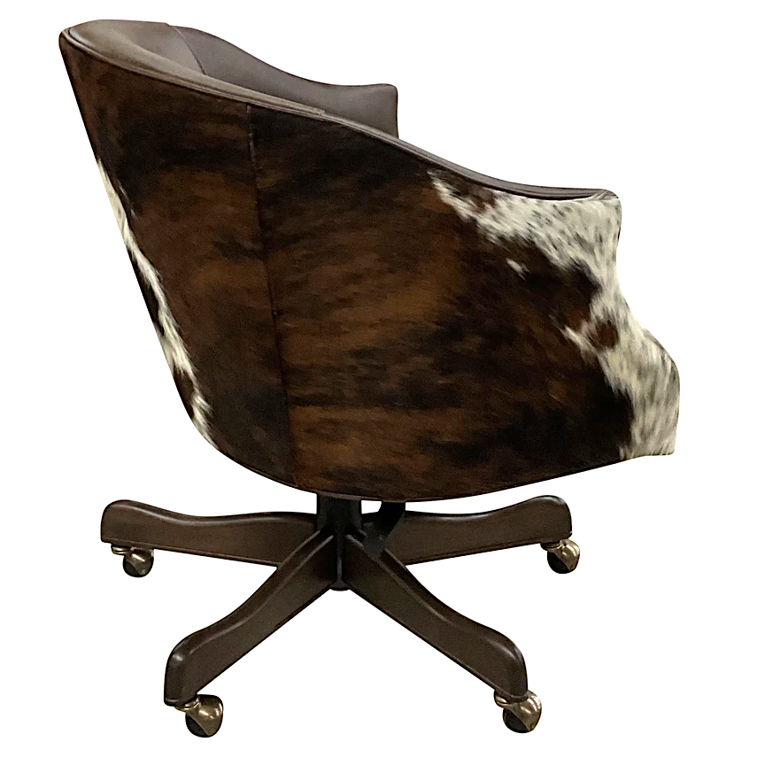 Side profile of the Black Canyon Cowhide Executive Swivel Chair showing sculpted barrel design and swivel base.