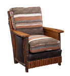 Wooden lodge style armchair with Sierra Madre striped fabric cushions and leather trim with nailheads and exposed bark detail 