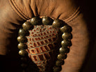 Detail of Smokey Lounge Arm Chair nail trim and croc embossed leather accent