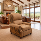 American-made smooth tan leather and brindle cowhide recliner styled in bright luxury ranch living room with stone fireplace, wood beam ceilings, and floor-to-ceiling windows
