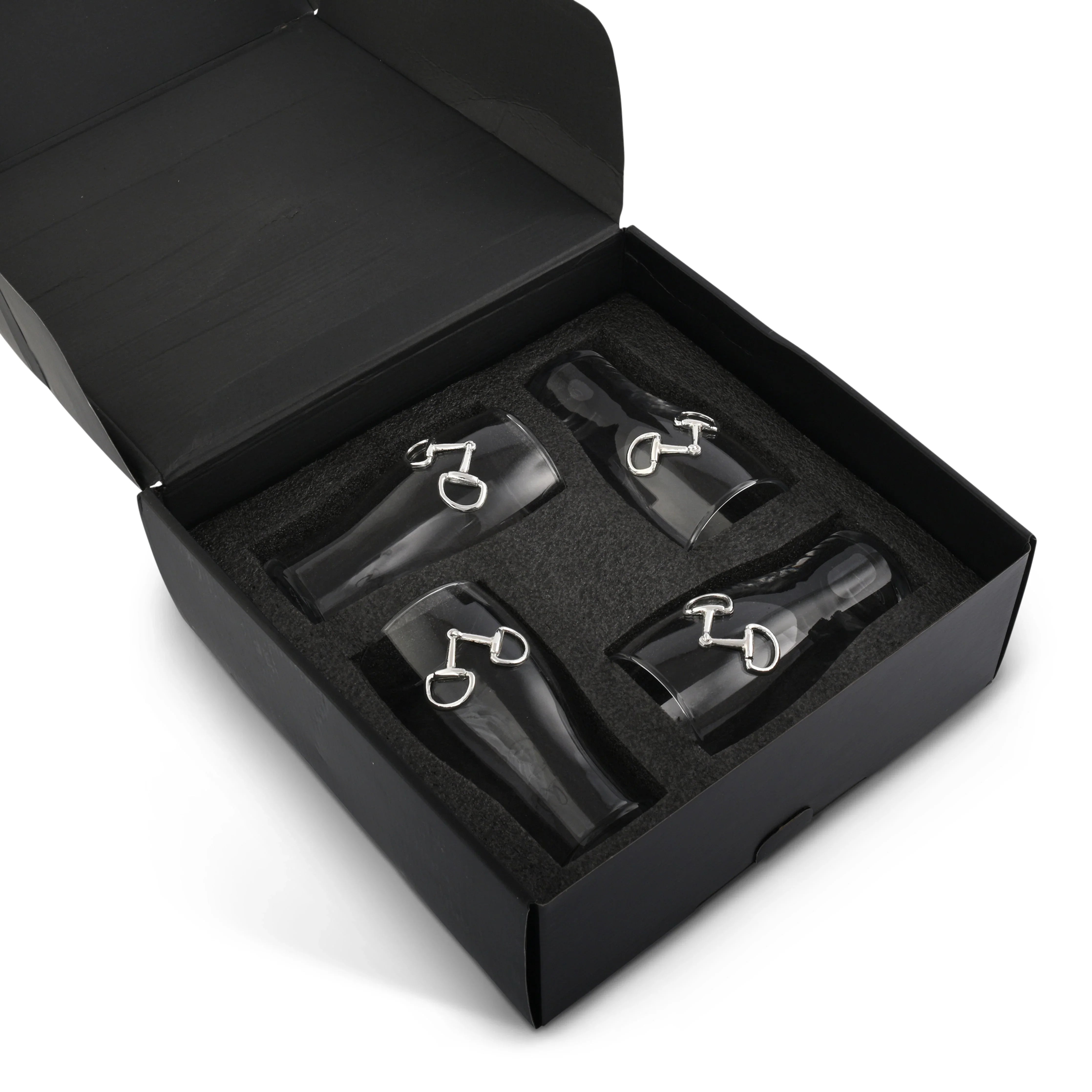 Set of 4 beer glasses with snaffle bit medallion in a black box on a white background