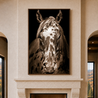 Spirit of the Nez Perce Appaloosa horse artwork displayed above a stone fireplace in a luxury mountain lodge.