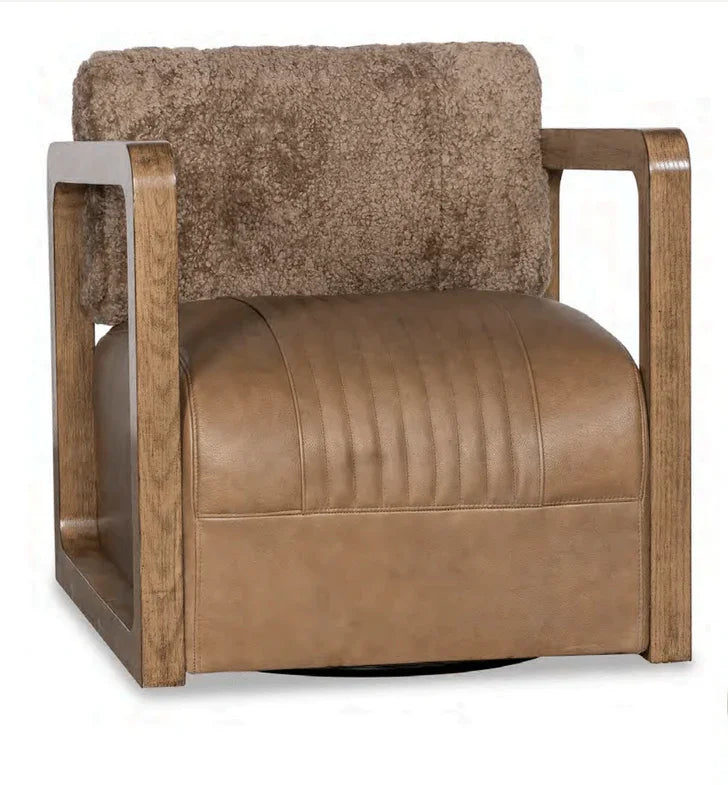Stella Shea Swivel Chair upholstered in burnished mushroom leather and New Zealand wool with hardwood frame in a luxury Western living room