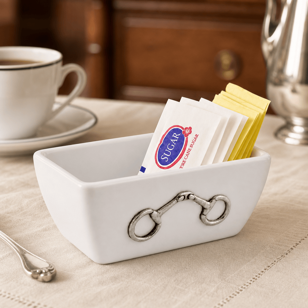 Equestrian sugar packet holder crafted from stoneware with decorative pewter horse bit accents