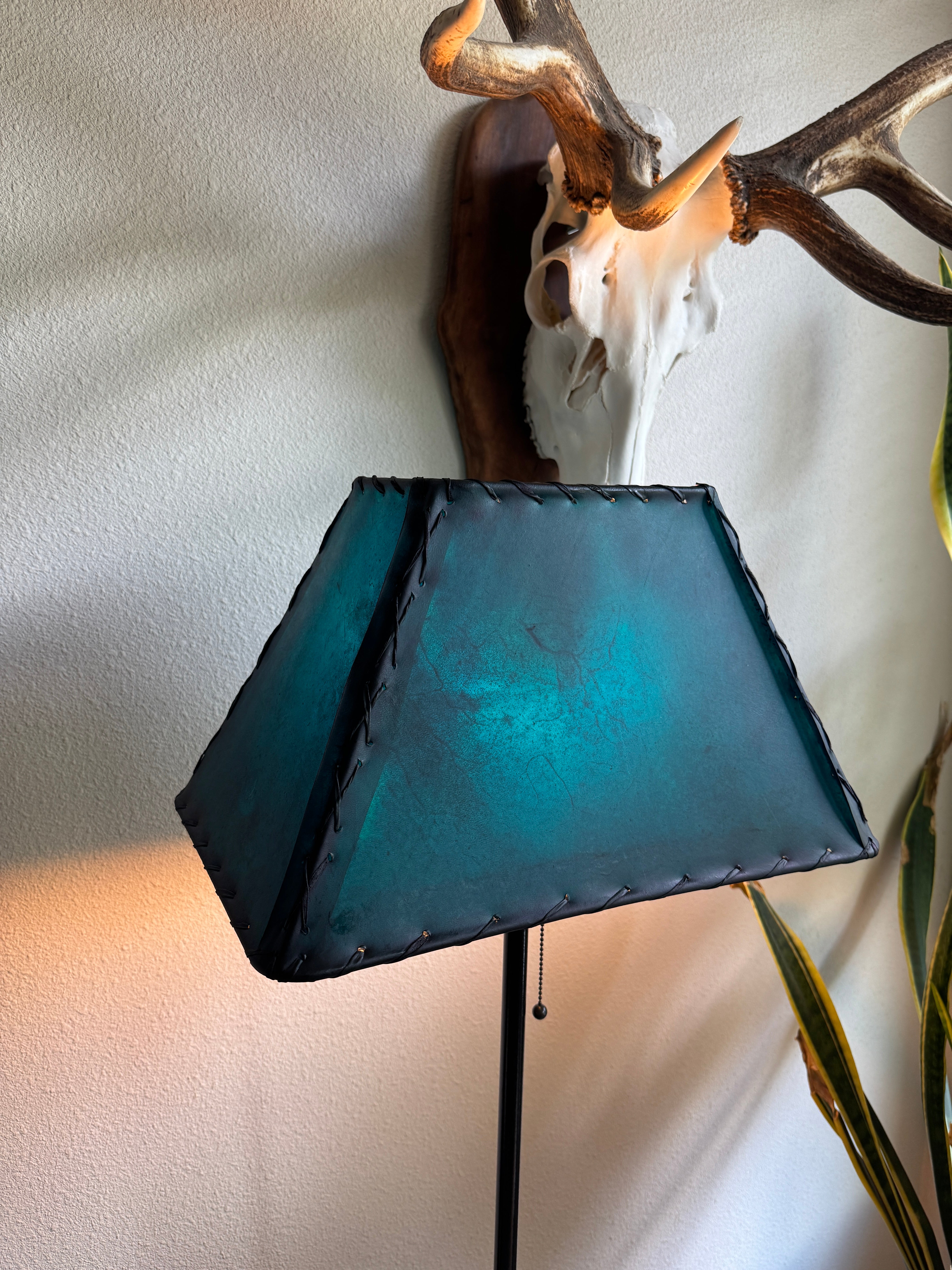 Western teal rawhide lamp shade with natural veining and rustic character