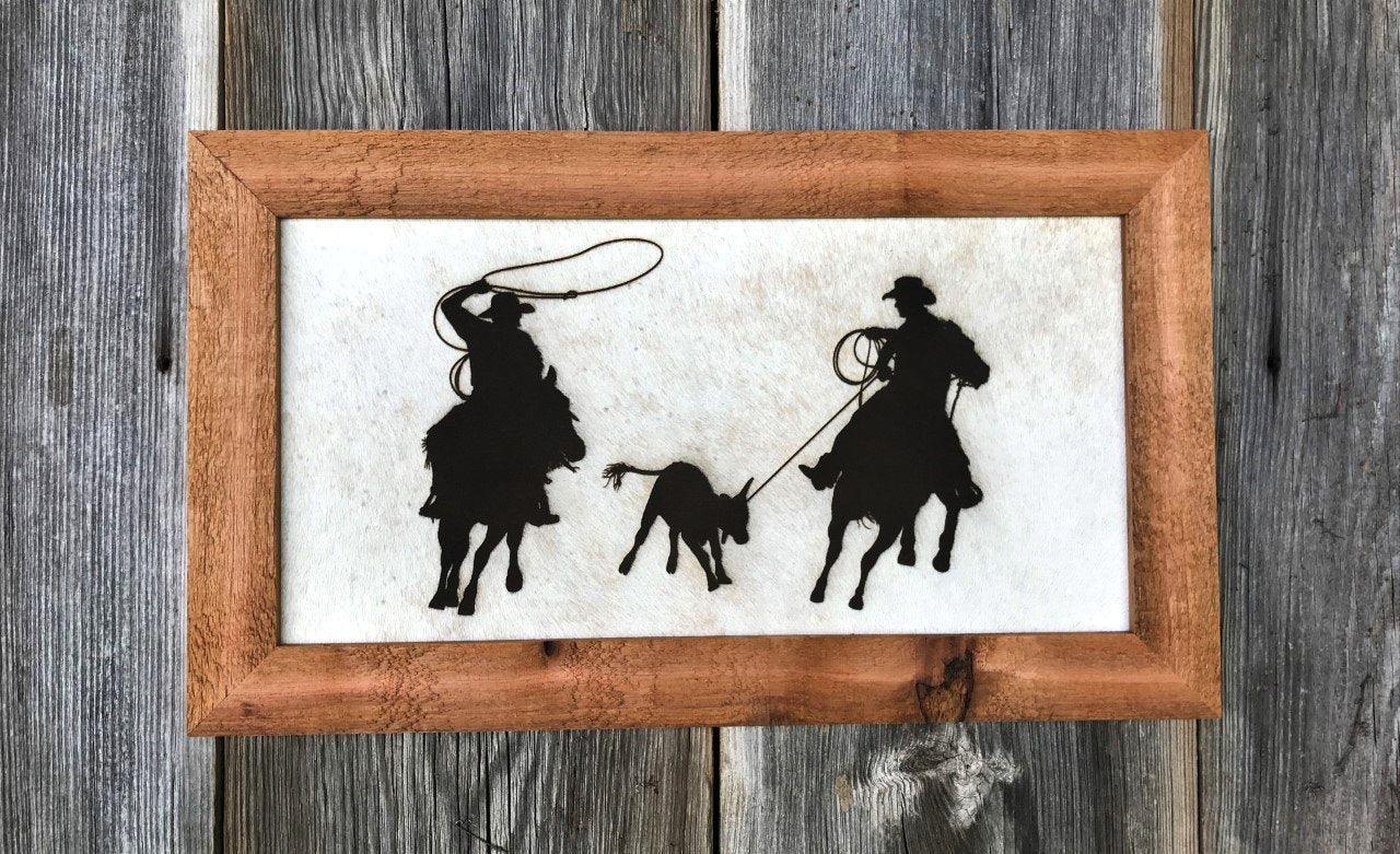 western ranch wall art with cowboys roping calf on hair on hide