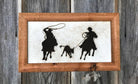 western ranch wall art with cowboys roping calf on hair on hide