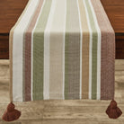 Striped table runner with tassels on a wooden surface - Your Western Decor
