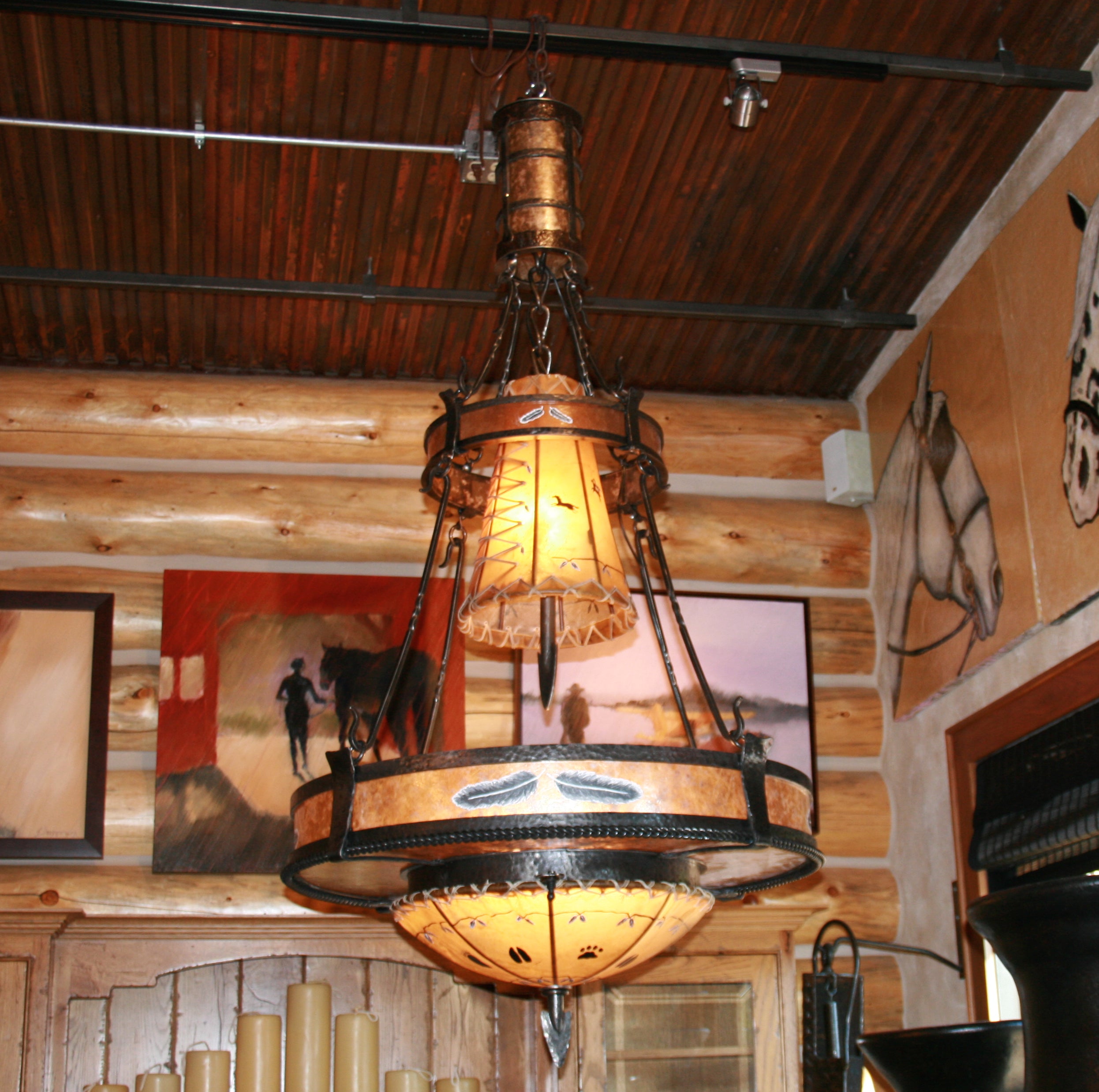 The Painted Feather Chandelier handmade of iron, mica, and rawhide in the USA - Your Western Decor