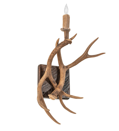 American made Elk antler wall sconce with natural shed antlers and candle style light in rustic lodge design