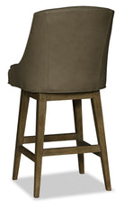 Brown leather bar stool with wooden legs on a white background