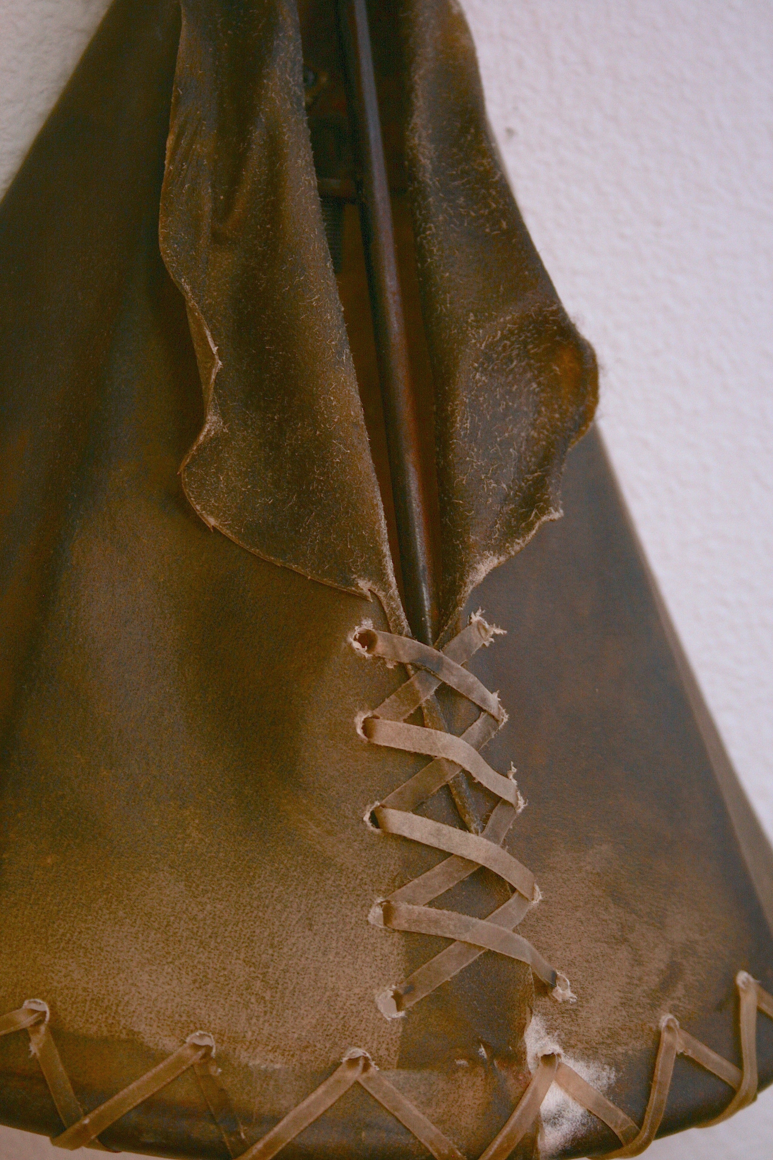 rustic western wall sconce rawhide laced shade warm ambient lighting decor