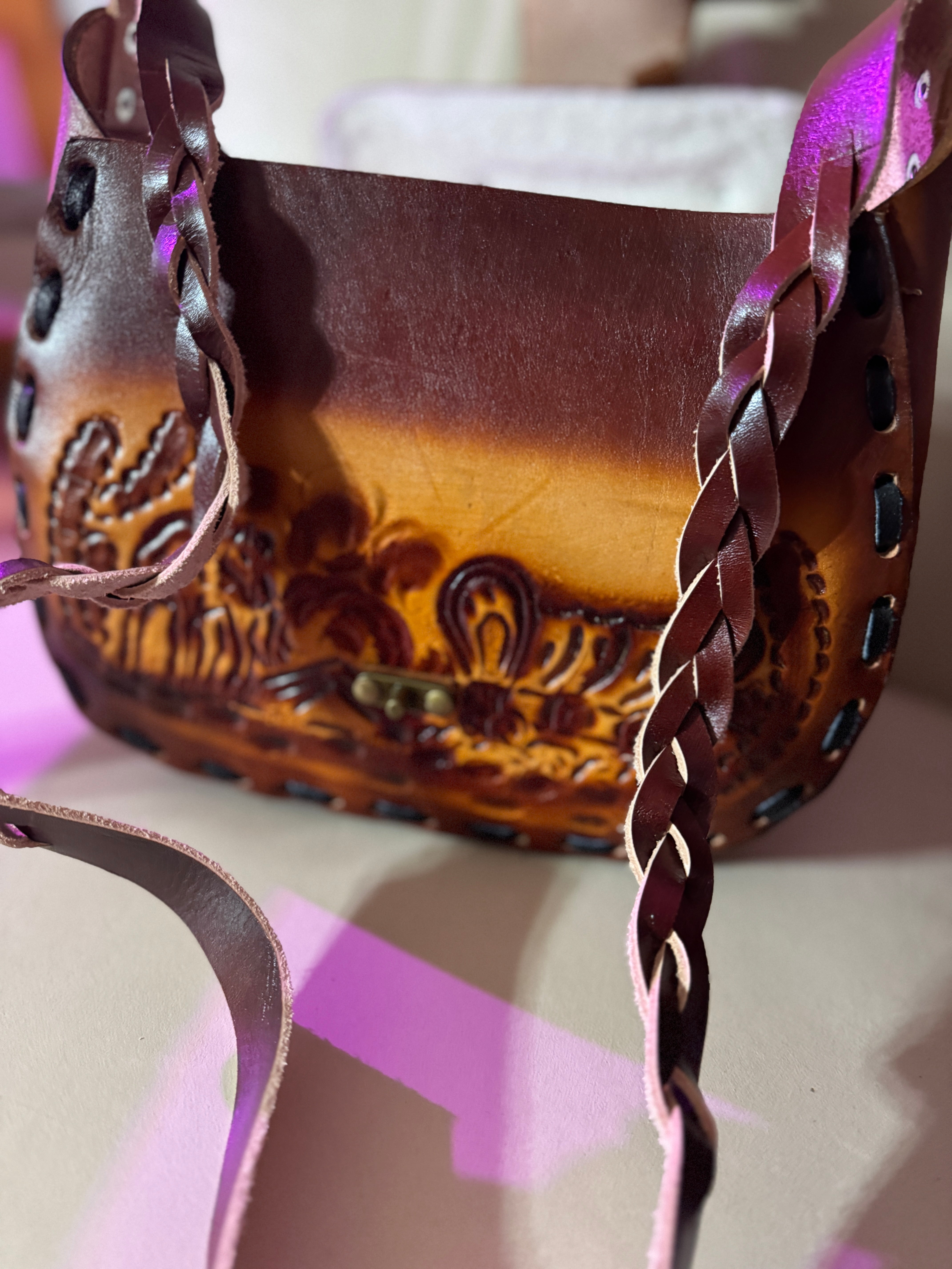 Tooled leather saddle purse with flap open and braided strap - Your Western Decor