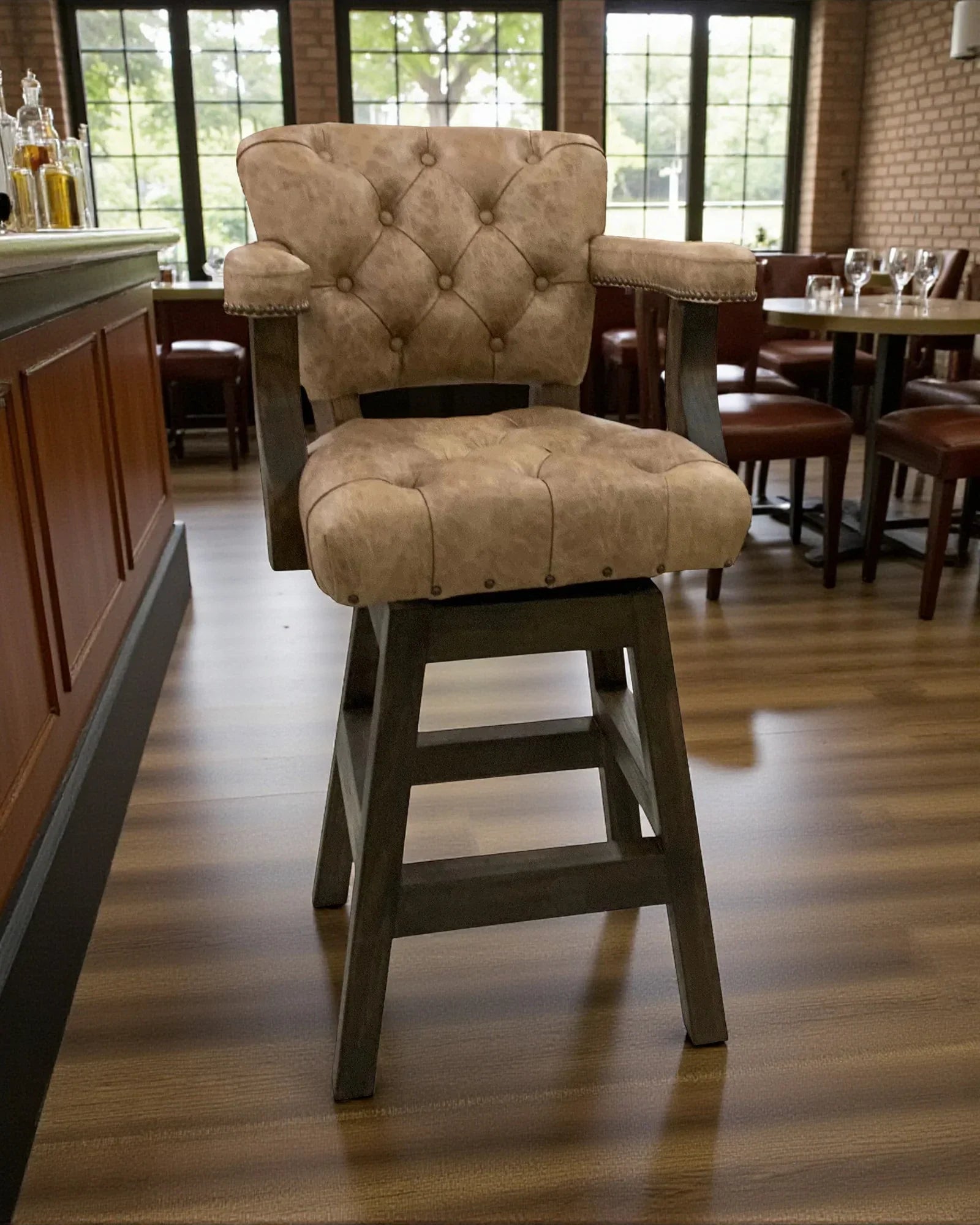 Bar stool with tufted cushion in a casual dining setting - Your Western Decor