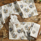 Table setting with turkey-patterned placemats, napkins, and cutlery on a wooden table - Your Western Decor