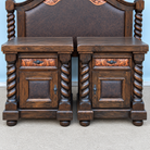 A pair of dark brown wooden nightstands with twisted columns and decorative leather drawer fronts, positioned in front of a matching dark brown leather upholstered headboard.