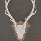 Grey Uncle Buck upholstery fabric with repeating stag skull and antler motif, Western lodge style deer pattern fabric for rustic furniture and décor