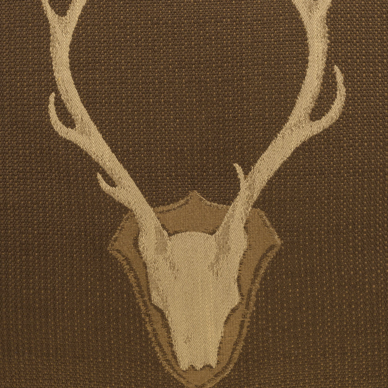 Brown Uncle Buck upholstery fabric featuring repeating stag skull and antler motif, Western lodge style deer pattern fabric for rustic furniture and ranch décor