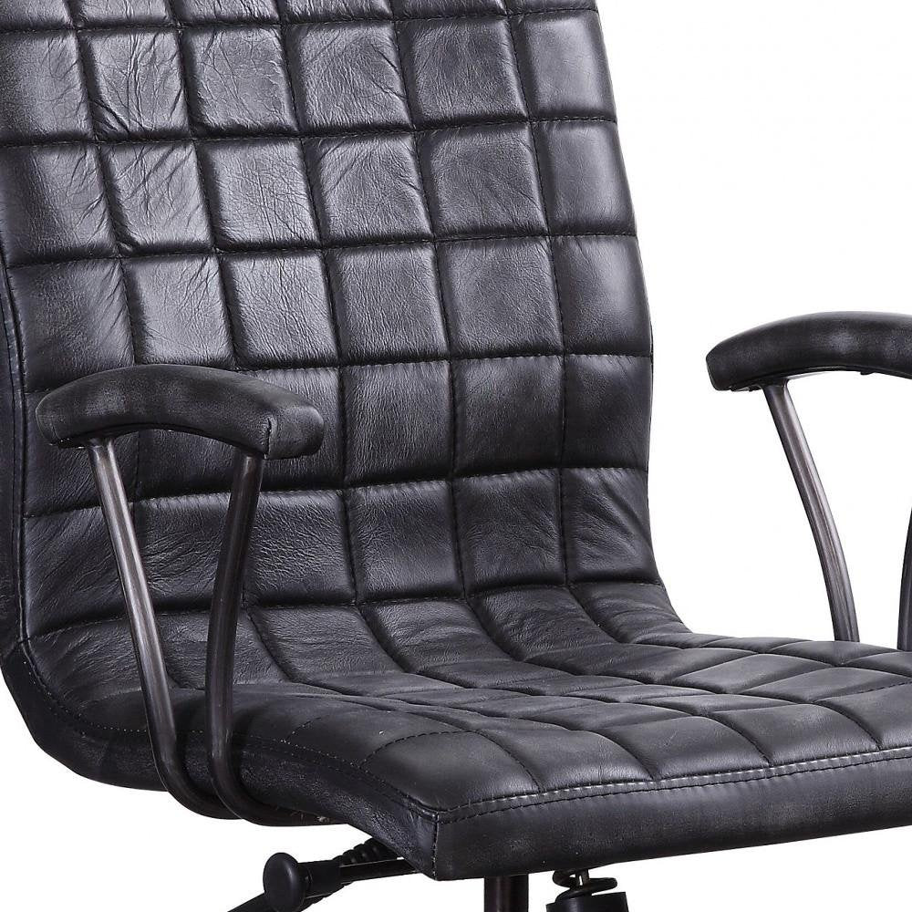 Upholstery detail on black leather office chair