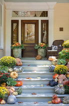 Decorative front steps with pumpkins, flowers, and a chair on a house exterior - Your Western Decor
