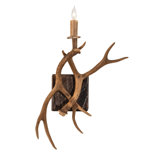 Elk antler wall sconce handcrafted in the USA with natural shed antlers and candle style light for rustic cabin design