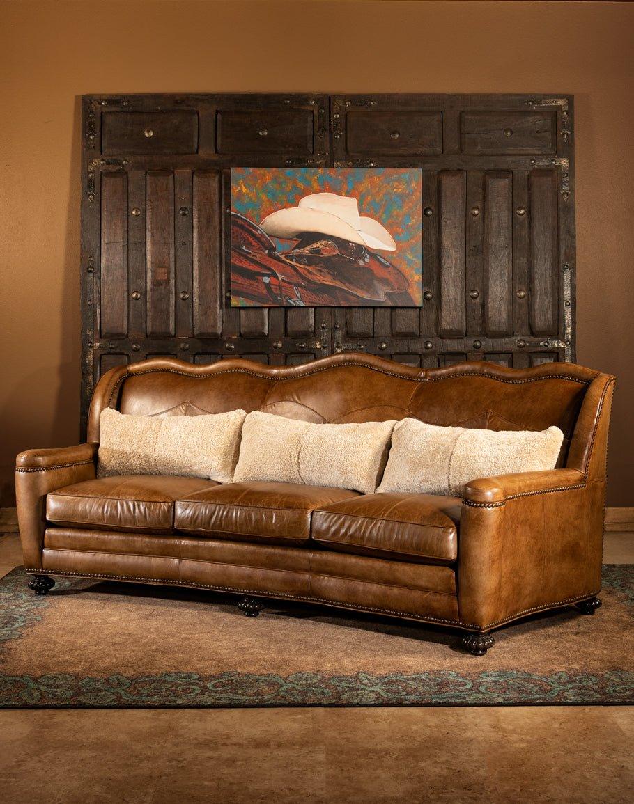 Leather sofa and tooled western area rug - Your Western Decor