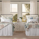 Two beds with matching headboards and Patchwork Western Paisley Quilt Set in a room with large windows - Your Western Decor