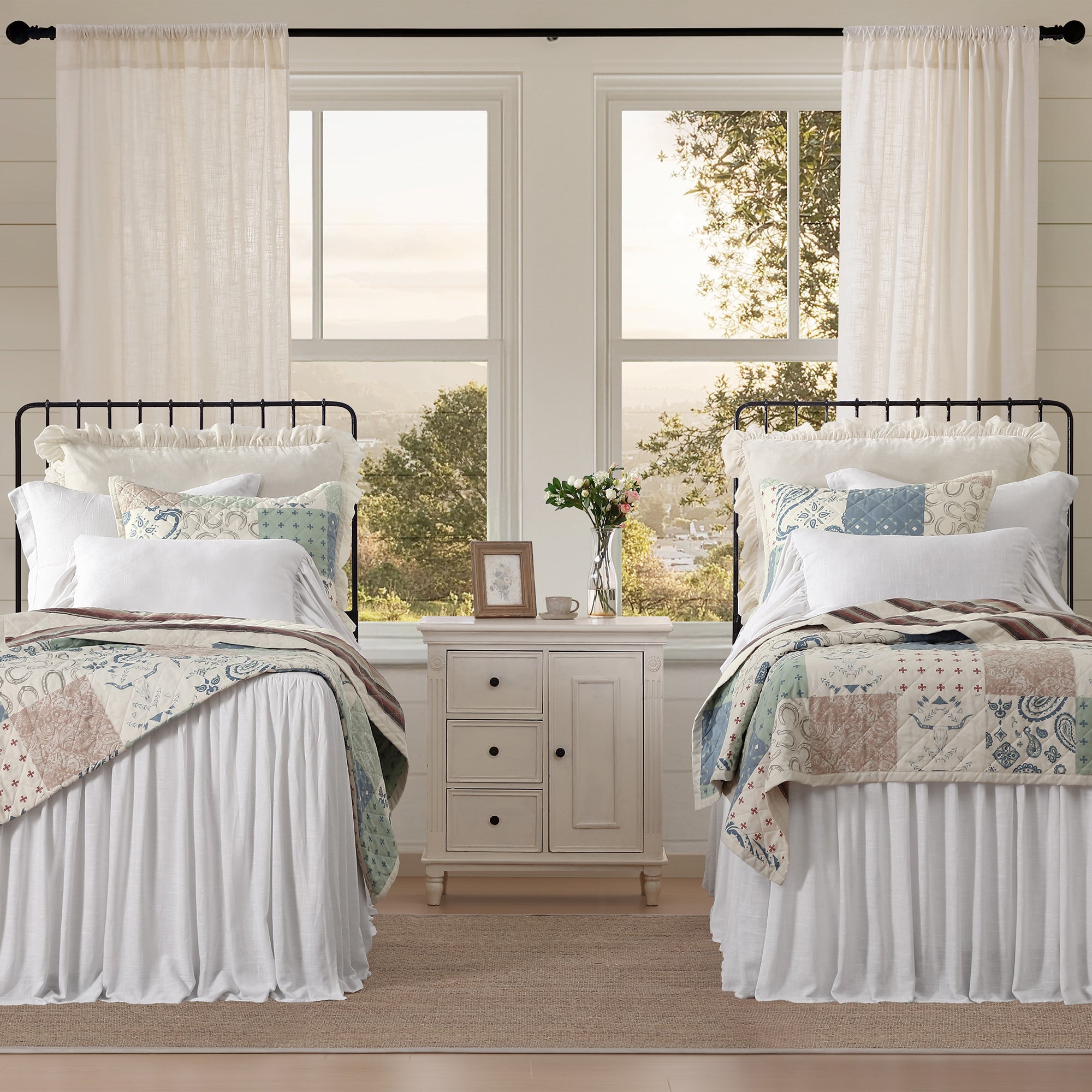Two beds with matching headboards and Patchwork Western Paisley Quilt Set in a room with large windows - Your Western Decor