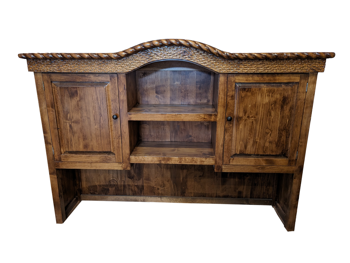 A rustic wooden hutch or sideboard cabinet with two paneled doors, two open shelves, and a decorative carved rope top edge, shown against a plain white background.