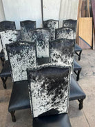 Western dining chairs upholstered in black leather and genuine peppered cowhide