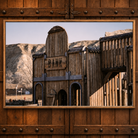 Western ghost town bank canvas art by Adam Mowrey featuring a weathered wooden facade, bank sign, and rugged hills in an oak-look floater frame.