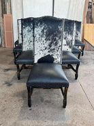 Peppered cowhide and black leather Western dining chairs handcrafted with nailhead trim and hardwood frames for luxury ranch dining rooms