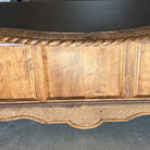detail of carved western desk with leather surface 