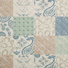 Patchwork pattern with blue and beige designs on a quilted fabric background - Your Western Decor