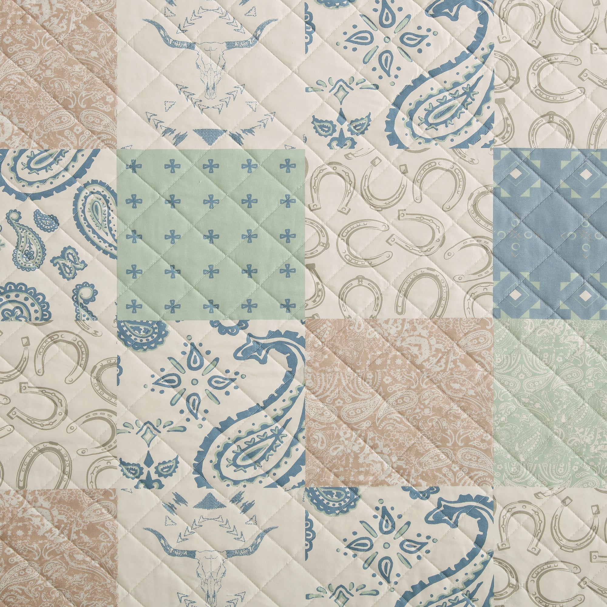 Patchwork pattern with blue and beige designs on a quilted fabric background - Your Western Decor
