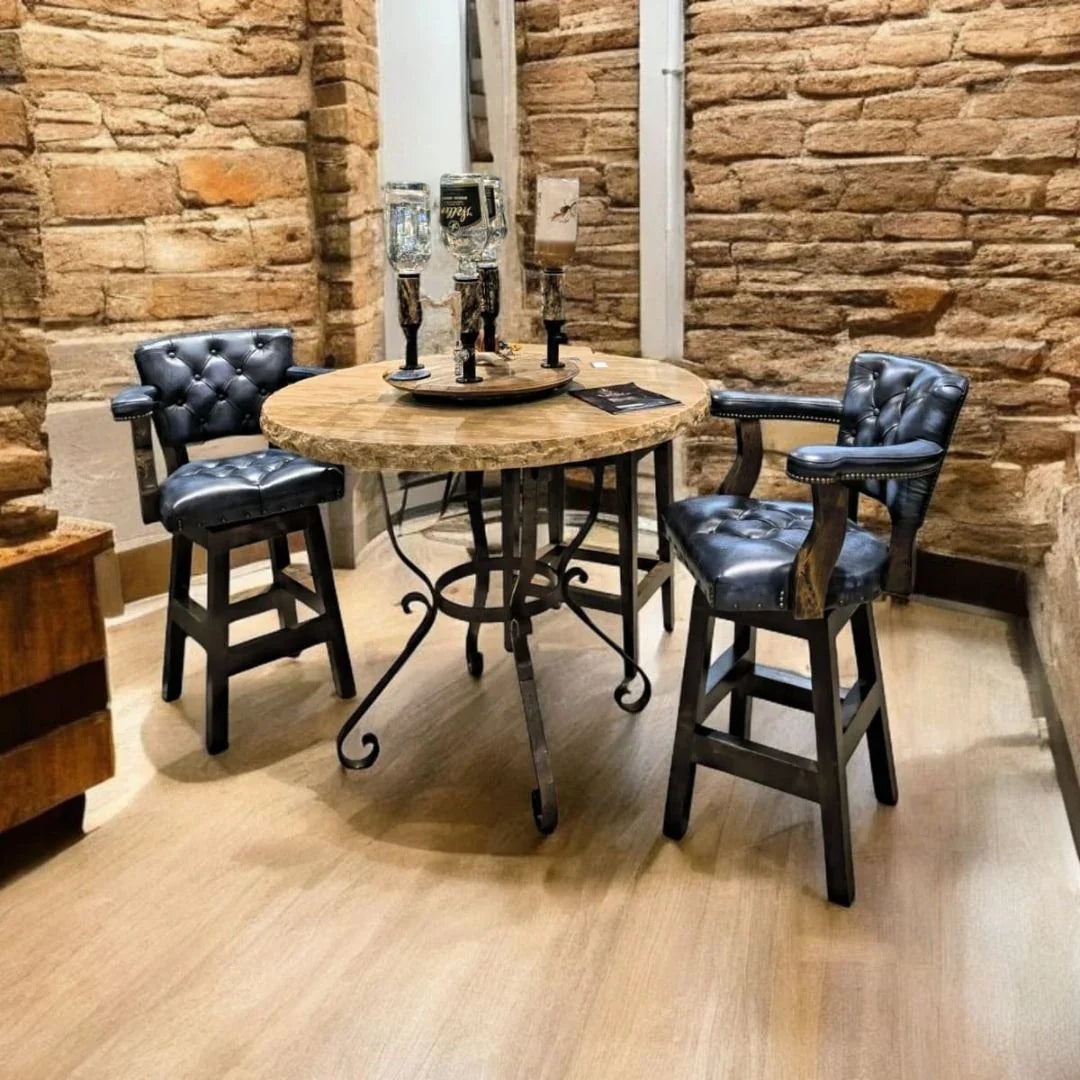 Burnished blue leather swivel tufted Western bar chair with arms in rustic ranch dining space