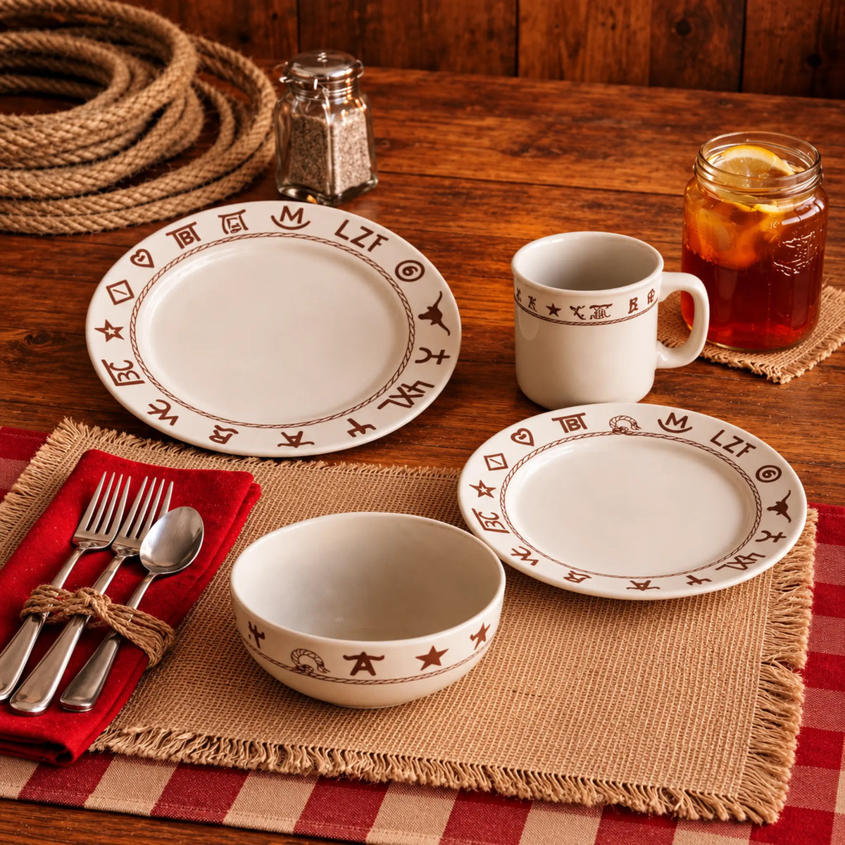 Beige western dishes with dark brown ranch brands and rope on western table setting