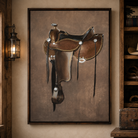 A framed vertical canvas print of a brown leather western saddle, displayed on a warm beige wall in a rustic room setting with a lantern and wooden shelving.