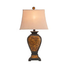 Resin tooled leather look western table lamp with linen shade and light on - Your Western Decor