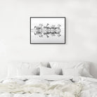 Framed canvas white horse art hanging over bed - Your Western Decor